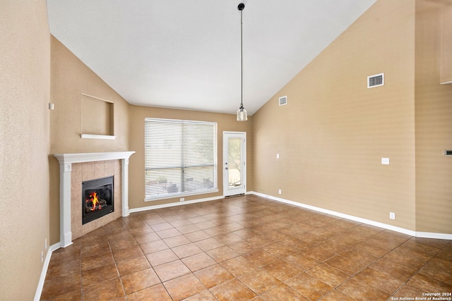 3415 Highline, San Antonio, TX 78261 - unfurnished living room featuring a fireplace, high vaulted ceiling, and tile patterned flooring