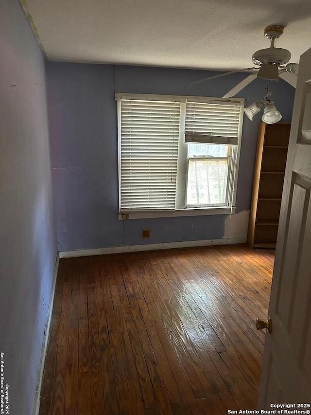 227 Noria St, San Antonio, TX 78207 - spare room with a ceiling fan and wood-type flooring