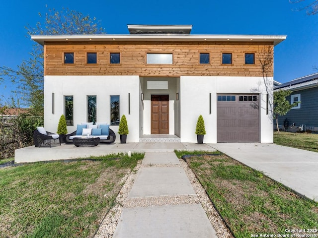 455 S Hackberry, New Braunfels, TX 78130 - contemporary house featuring outdoor lounge area, an attached garage, stucco siding, and concrete driveway