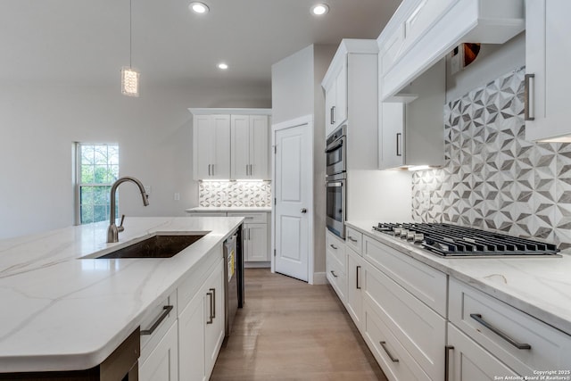 455 S Hackberry, New Braunfels, TX 78130 - kitchen featuring stainless steel appliances, recessed lighting, white cabinets, decorative light fixtures, and decorative backsplash