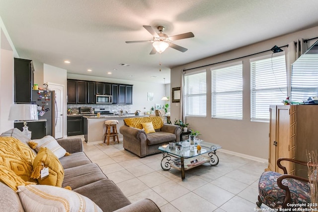6723 Dashmoor, San Antonio, TX 78244 - living area with light tile patterned floors, ceiling fan, and recessed lighting