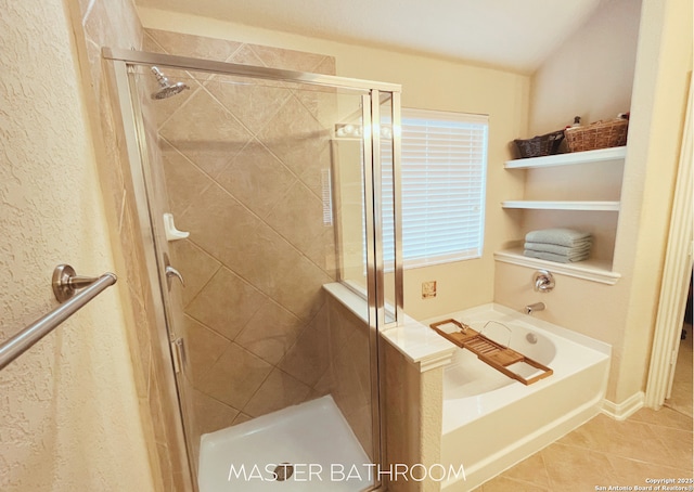 4018 Matson Mnr, Converse, TX 78109 - bathroom featuring a garden tub, tile patterned floors, a stall shower, and a textured wall