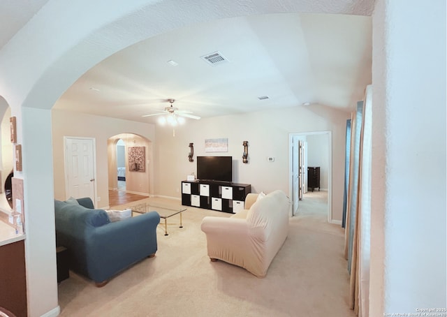 4018 Matson Mnr, Converse, TX 78109 - living room featuring arched walkways, ceiling fan, and light carpet