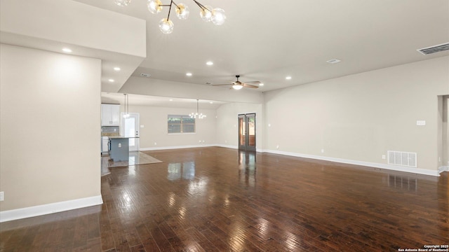 1069 Ivy Ln, Terrell Hills, TX 78209 - unfurnished living room with a chandelier, recessed lighting, a ceiling fan, and dark wood finished floors