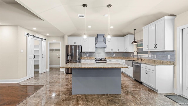 1069 Ivy Ln, Terrell Hills, TX 78209 - kitchen with appliances with stainless steel finishes, custom exhaust hood, a barn door, dark marble finish flooring, and lofted ceiling