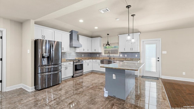 1069 Ivy Ln, Terrell Hills, TX 78209 - kitchen featuring stainless steel appliances, wall chimney exhaust hood, white cabinets, backsplash, and recessed lighting