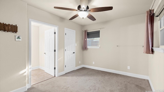 1069 Ivy Ln, Terrell Hills, TX 78209 - unfurnished bedroom featuring light carpet and ceiling fan