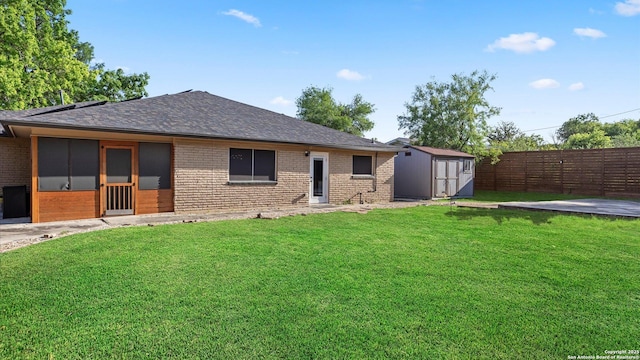 1069 Ivy Ln, Terrell Hills, TX 78209 - rear view of house featuring brick siding, a storage shed, and a shingled roof