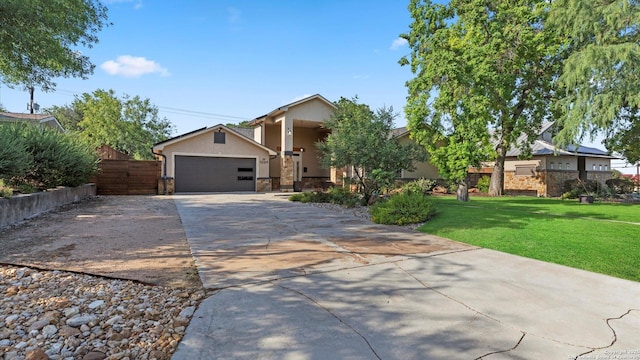 1069 Ivy Ln, Terrell Hills, TX 78209 - view of front of house with a front lawn, stucco siding, concrete driveway, stone siding, and an attached garage