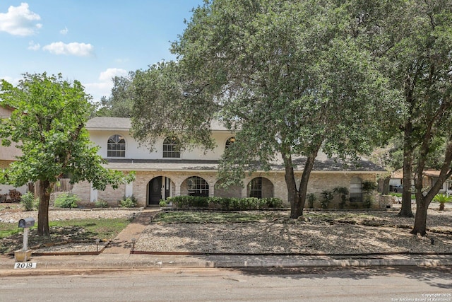 2019 Crooked, San Antonio, TX 78232 - view of front of property featuring brick siding, stucco siding, and a porch