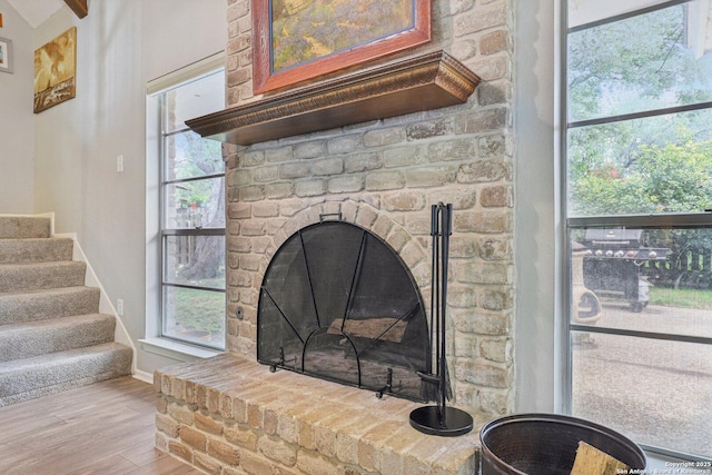 2019 Crooked, San Antonio, TX 78232 - detailed view of wood finished floors and a brick fireplace