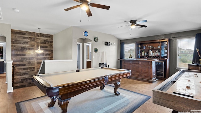 702 Pelican Pt, San Antonio, TX 78221 - recreation room featuring wine cooler, a bar, ceiling fan, and healthy amount of natural light