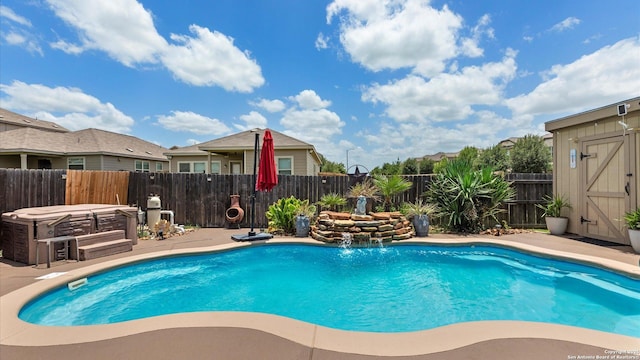 702 Pelican Pt, San Antonio, TX 78221 - view of swimming pool with a fenced backyard, a hot tub, a patio, and a storage shed