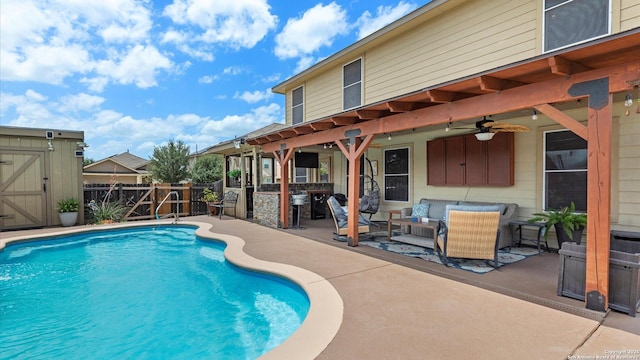 702 Pelican Pt, San Antonio, TX 78221 - view of swimming pool featuring a patio area, a fenced backyard, ceiling fan, and an outdoor hangout area
