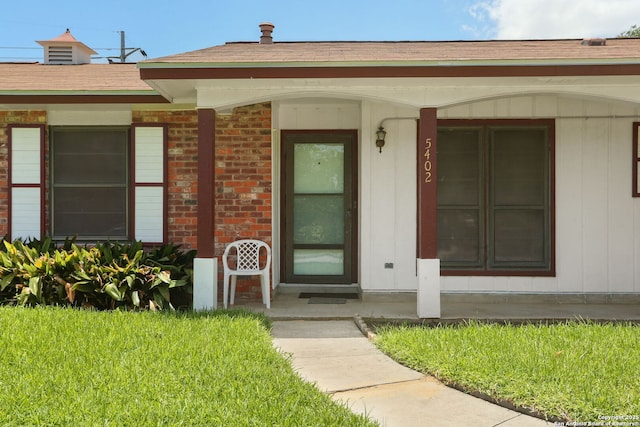 5402 Happiness, Kirby, TX 78219 - property entrance with brick siding, covered porch, and a shingled roof