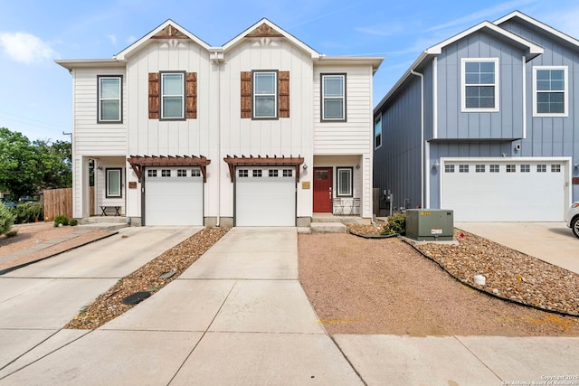 7934 Teak Ln, San Antonio, TX 78209 - view of front of property with board and batten siding, concrete driveway, and an attached garage