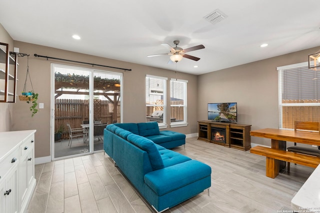 7934 Teak Ln, San Antonio, TX 78209 - living room featuring ceiling fan, light wood finished floors, and recessed lighting