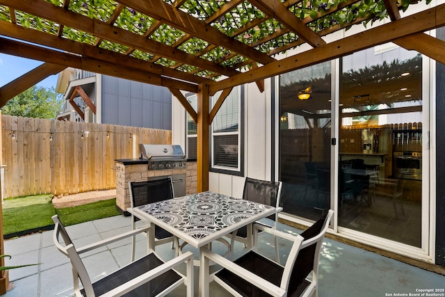 7934 Teak Ln, San Antonio, TX 78209 - view of patio with exterior kitchen, a pergola, and outdoor dining space