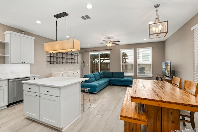 7934 Teak Ln, San Antonio, TX 78209 - kitchen with dishwasher, open shelves, light countertops, white cabinets, and hanging light fixtures
