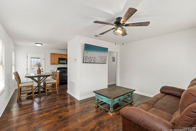 227 Anton Dr, San Antonio, TX 78223 - living area featuring dark wood-style flooring and ceiling fan