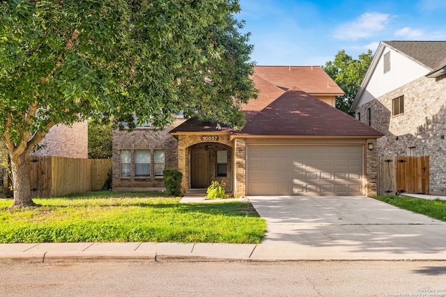 10057 Fall Harvest, San Antonio, TX 78254 - view of front of property featuring a garage, driveway, brick siding, and a shingled roof
