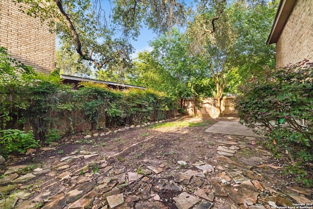 10057 Fall Harvest, San Antonio, TX 78254 - fenced backyard featuring a patio