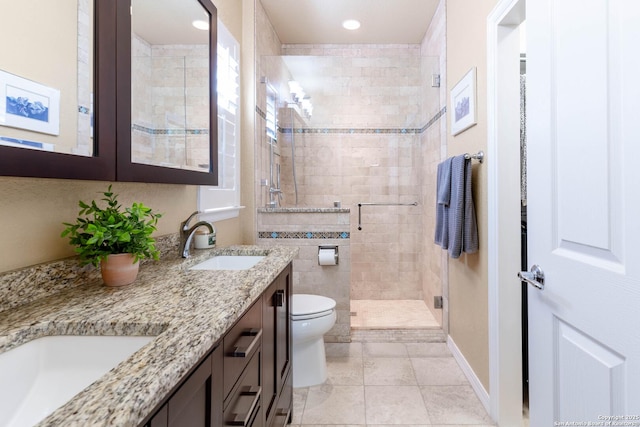 12610 Lotus Rdg, San Antonio, TX 78253 - bathroom featuring a stall shower, double vanity, tile patterned flooring, and recessed lighting