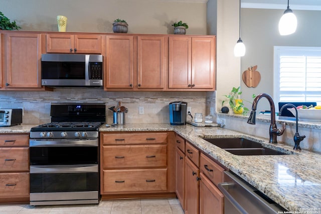 12610 Lotus Rdg, San Antonio, TX 78253 - kitchen with appliances with stainless steel finishes, decorative backsplash, light stone counters, brown cabinets, and light tile patterned floors