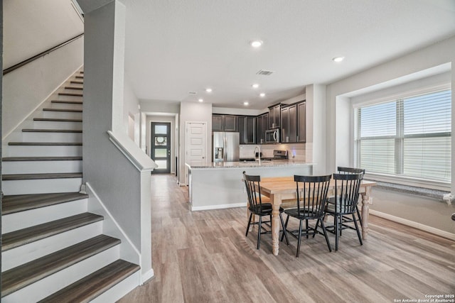 4931 Ranahan Pass, Saint Hedwig, TX 78152 - dining room with light wood-type flooring, stairway, and recessed lighting