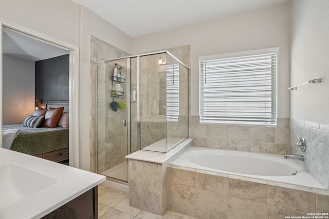 4931 Ranahan Pass, Saint Hedwig, TX 78152 - bathroom featuring a bath, a shower stall, ensuite bathroom, vanity, and tile patterned floors