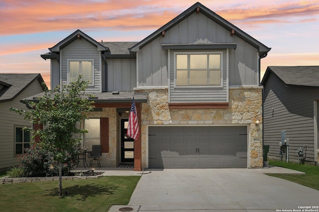 4931 Ranahan Pass, Saint Hedwig, TX 78152 - view of front of home with stone siding, board and batten siding, concrete driveway, and an attached garage