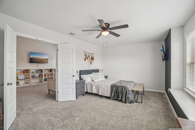 4931 Ranahan Pass, Saint Hedwig, TX 78152 - carpeted bedroom featuring a ceiling fan and baseboards