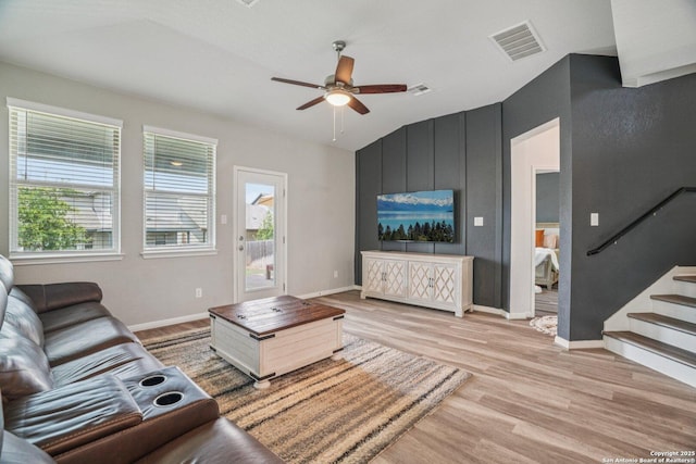 4931 Ranahan Pass, Saint Hedwig, TX 78152 - living area with light wood-type flooring, plenty of natural light, a ceiling fan, stairway, and vaulted ceiling