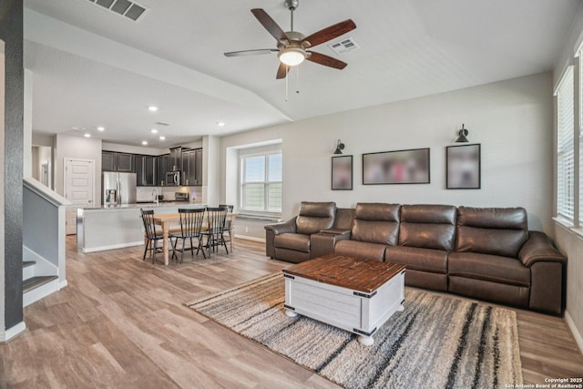 4931 Ranahan Pass, Saint Hedwig, TX 78152 - living room featuring light wood finished floors, a ceiling fan, stairway, recessed lighting, and lofted ceiling