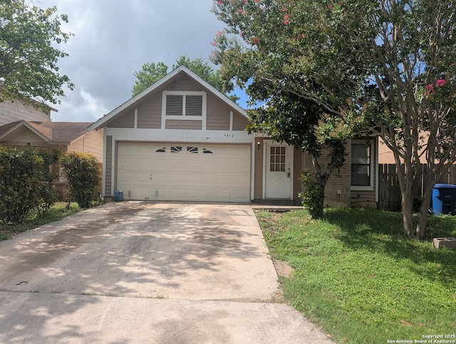 9434 Valley Rock, San Antonio, TX 78250 - view of front of house featuring driveway, an attached garage, and a front yard