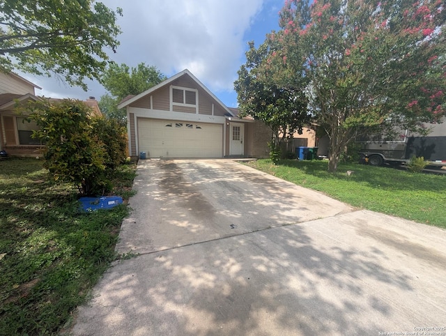9434 Valley Rock, San Antonio, TX 78250 - view of front facade featuring concrete driveway, a front yard, and a garage
