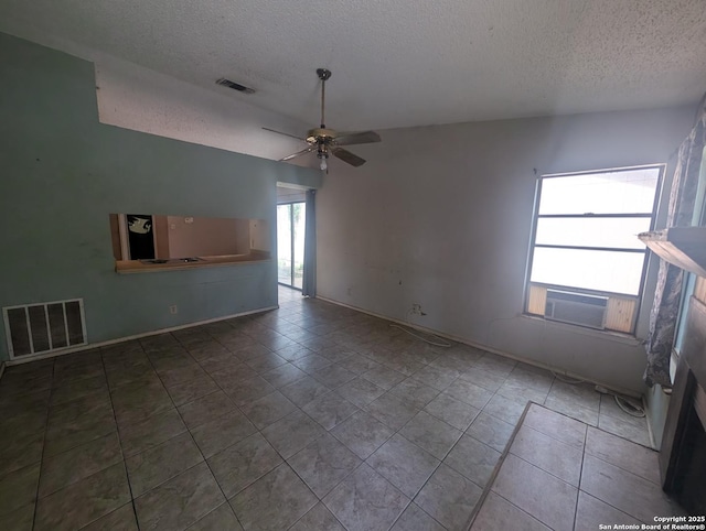 9434 Valley Rock, San Antonio, TX 78250 - tiled empty room with a textured ceiling, ceiling fan, and cooling unit