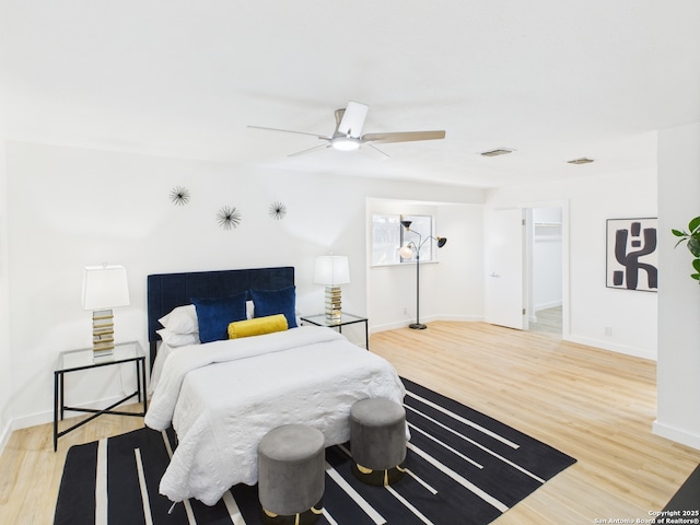 7007 Elk Trl, San Antonio, TX 78244 - bedroom featuring light wood-style floors, ceiling fan, and a spacious closet