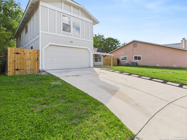 7007 Elk Trl, San Antonio, TX 78244 - view of front facade with a garage, driveway, and board and batten siding