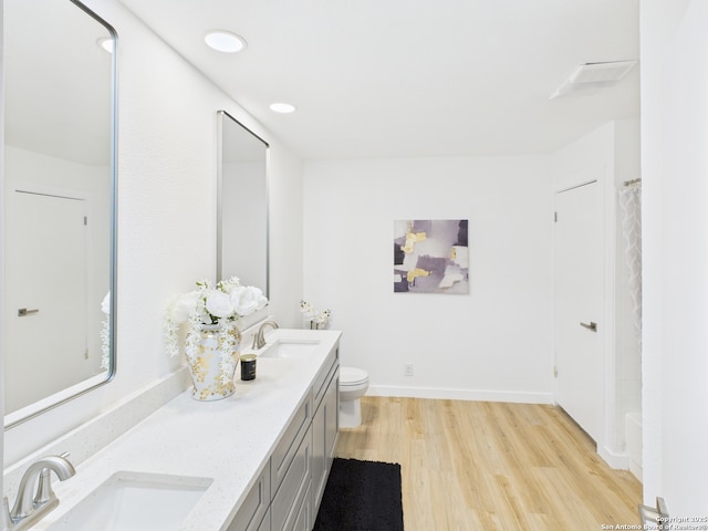 7007 Elk Trl, San Antonio, TX 78244 - full bathroom with double vanity, wood finished floors, curtained shower, and recessed lighting
