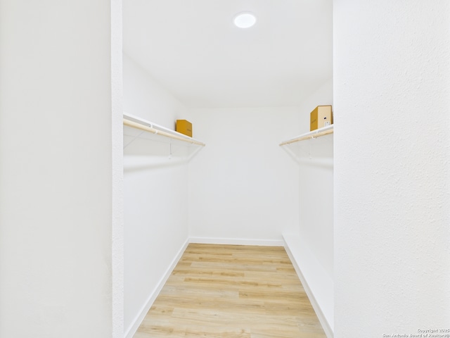 7007 Elk Trl, San Antonio, TX 78244 - spacious closet with light wood finished floors