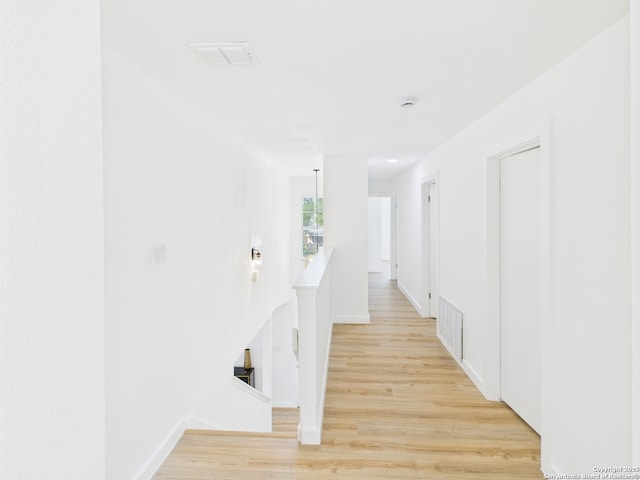 7007 Elk Trl, San Antonio, TX 78244 - hall with an upstairs landing and light wood-style flooring