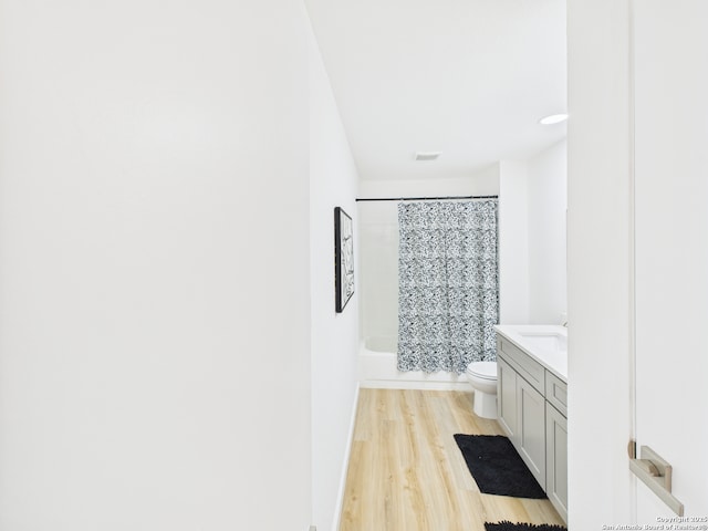 7007 Elk Trl, San Antonio, TX 78244 - full bath with wood finished floors, vanity, and shower / bath combo with shower curtain