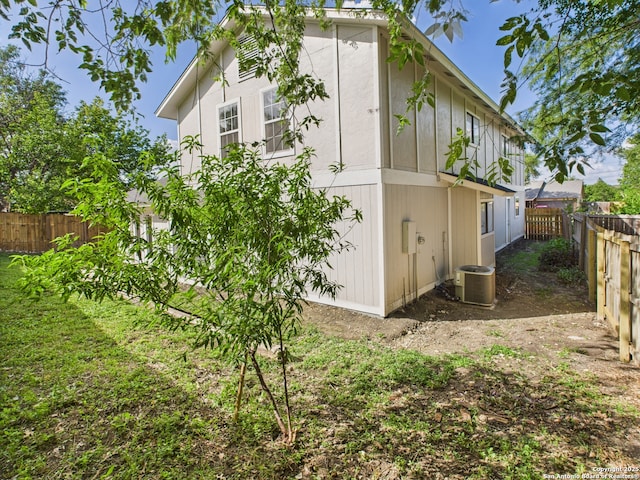 7007 Elk Trl, San Antonio, TX 78244 - view of side of property with a fenced backyard and a central AC unit