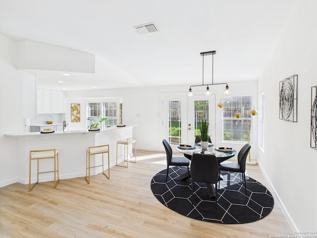 7007 Elk Trl, San Antonio, TX 78244 - dining room with light wood-type flooring, healthy amount of natural light, and recessed lighting