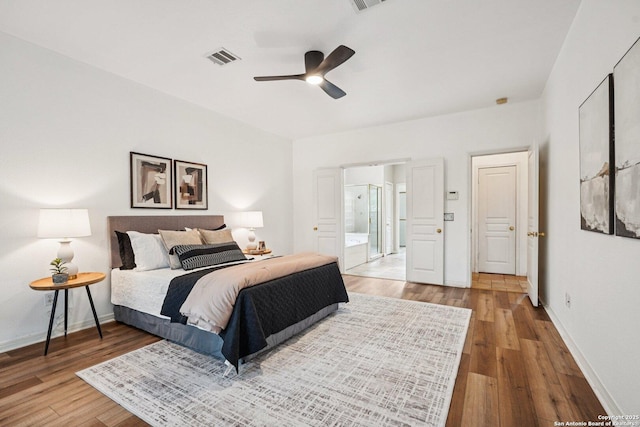 1159 Bluff Frst, San Antonio, TX 78248 - bedroom featuring wood finished floors, ensuite bathroom, and ceiling fan