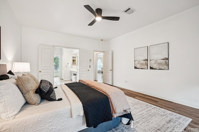 1159 Bluff Frst, San Antonio, TX 78248 - bedroom featuring wood finished floors, ensuite bathroom, and a ceiling fan