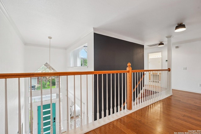1159 Bluff Frst, San Antonio, TX 78248 - hallway featuring crown molding, wood finished floors, and an upstairs landing