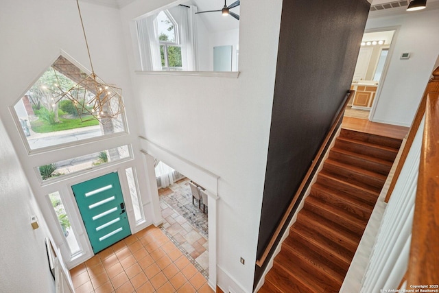 1159 Bluff Frst, San Antonio, TX 78248 - tiled entryway featuring a high ceiling, a chandelier, plenty of natural light, and stairs