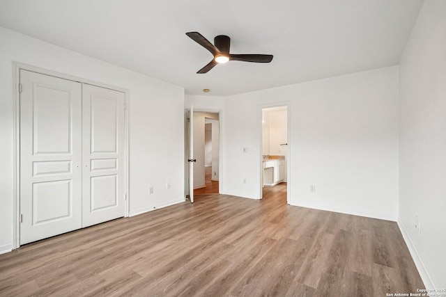 1159 Bluff Frst, San Antonio, TX 78248 - unfurnished bedroom featuring light wood-style flooring, a closet, connected bathroom, and ceiling fan